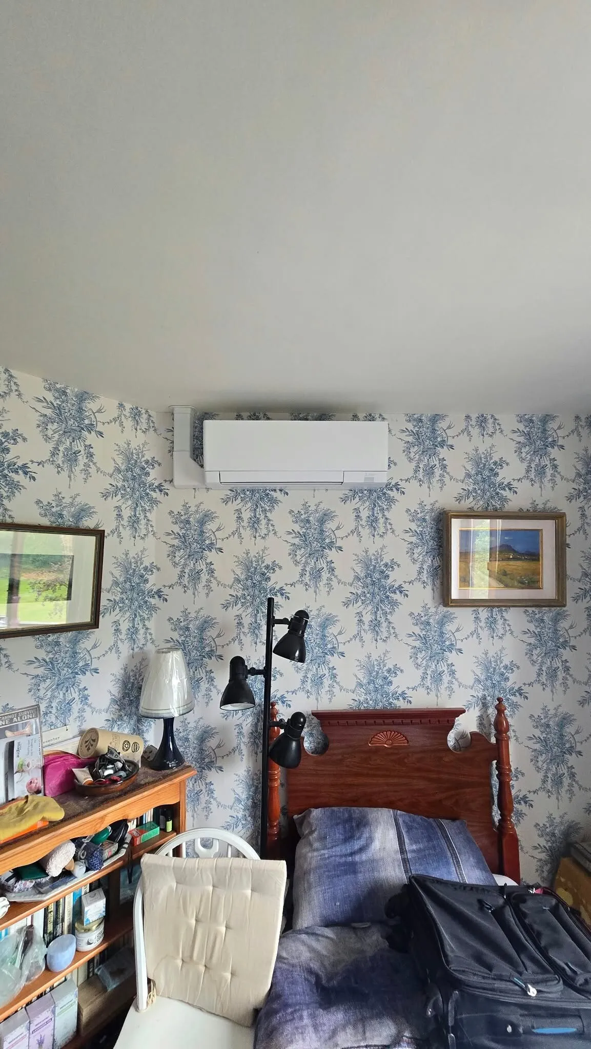 Wall-mounted air conditioner in a bedroom