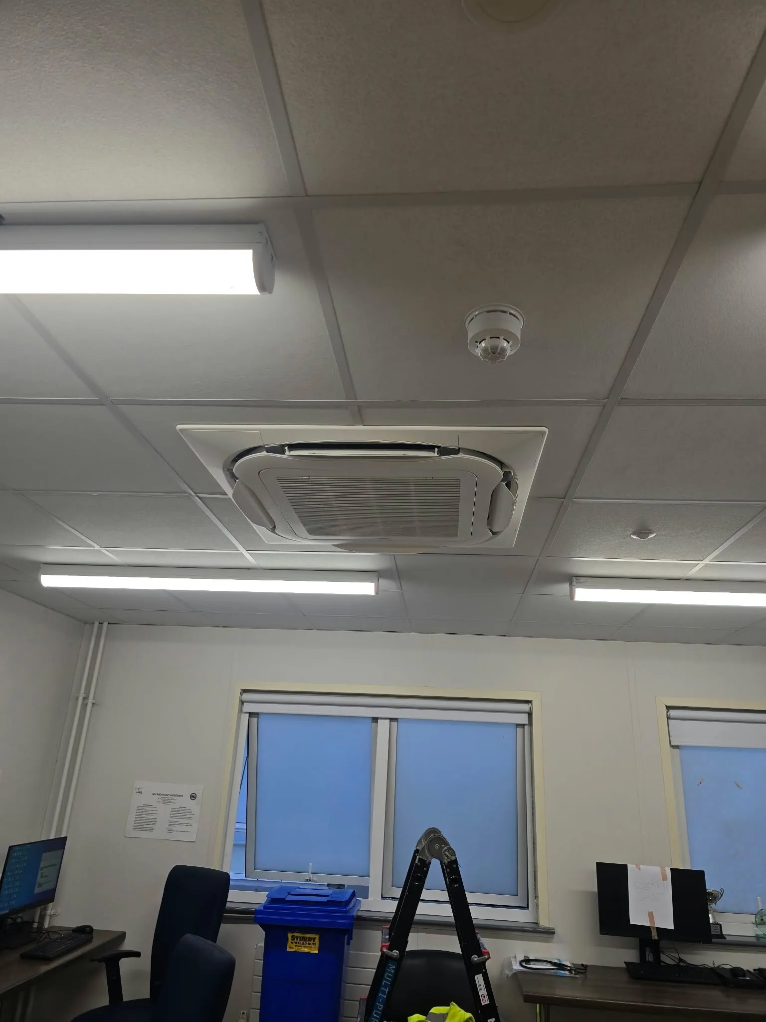 Ceiling cassette air conditioning unit in an office