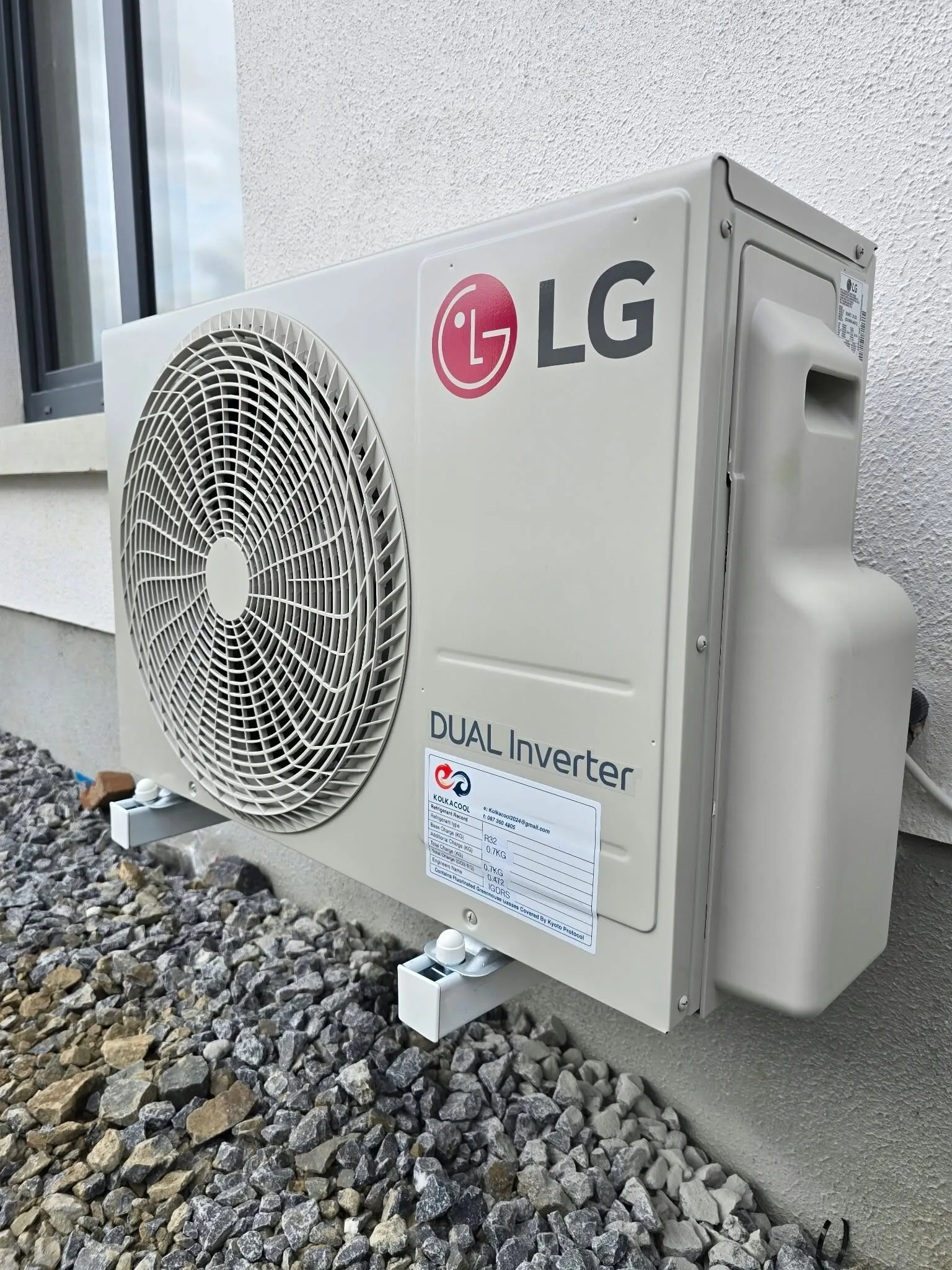 LG Dual Inverter outdoor unit on a gravel base