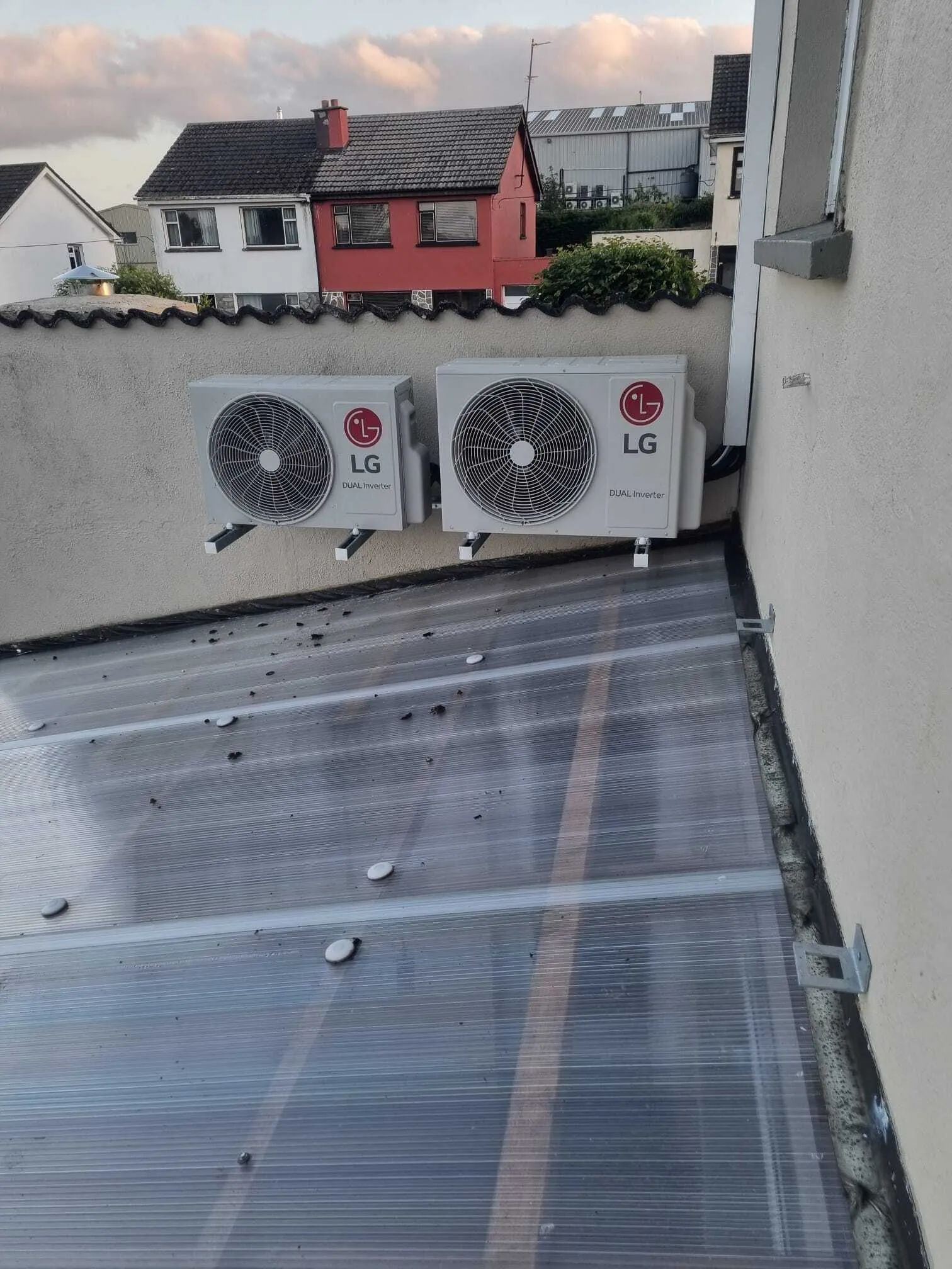 Two LG outdoor units on a flat roof