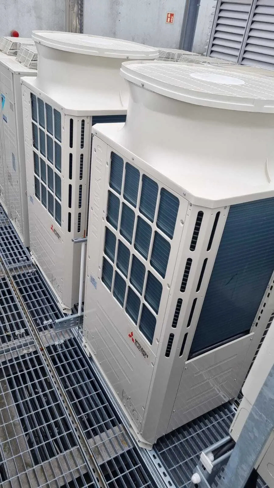 Mitsubishi Electric VRF units on a rooftop grille