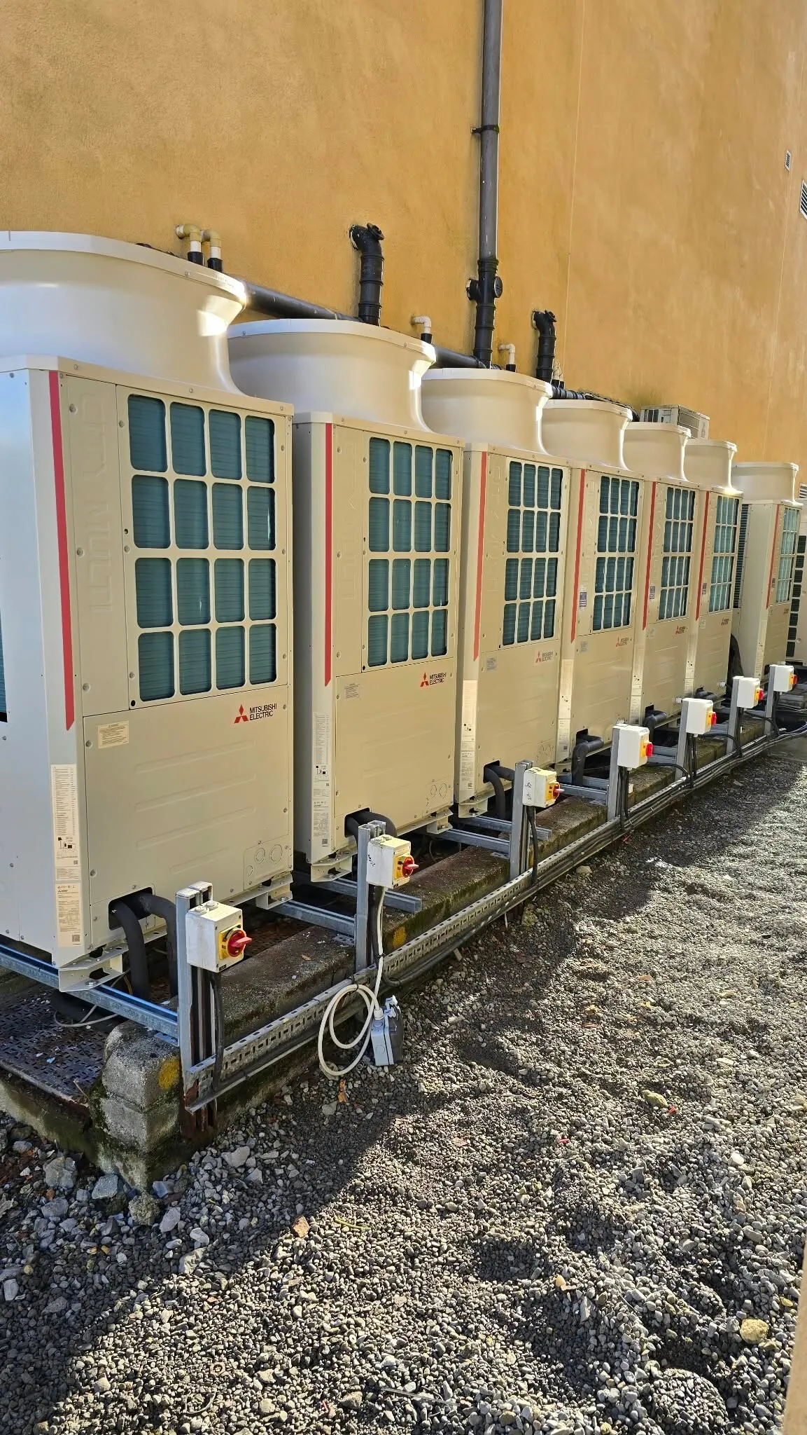 Mitsubishi VRF outdoor units on a steel frame