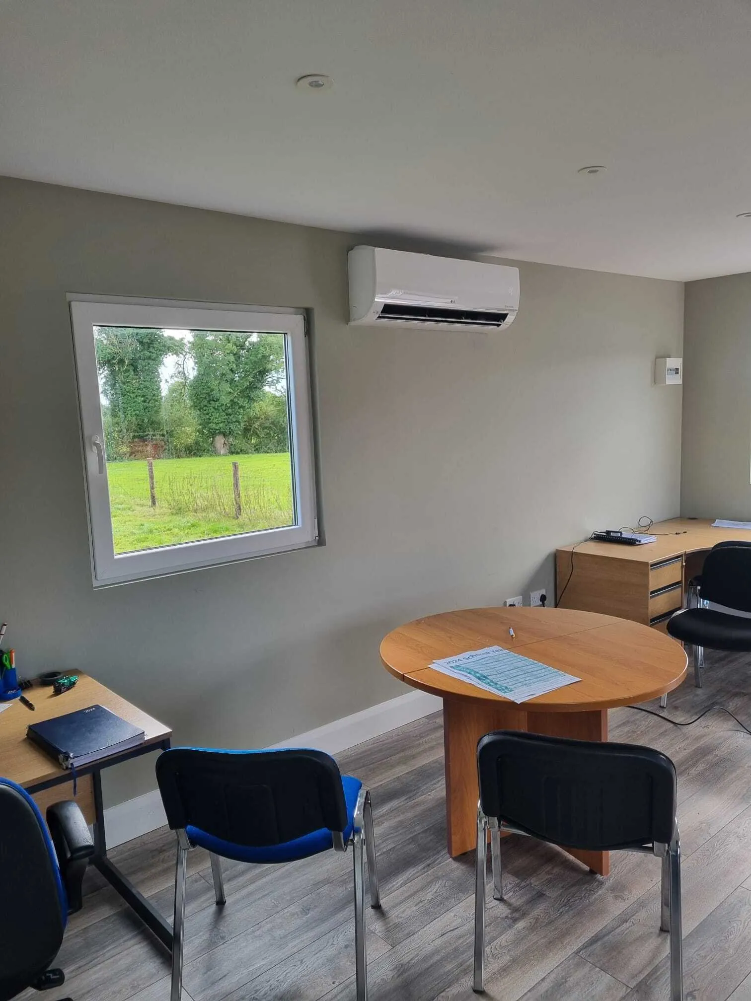 Wall-mounted air conditioner in a small office meeting room